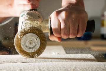 Processing the board with a metal brush. Method of aging of wood.