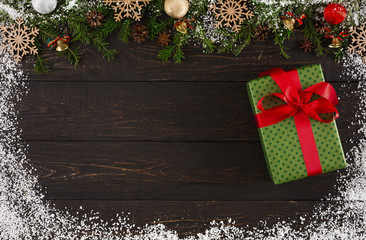 Fototapeta na wymiar Christmas decoration, gift box and garland frame background