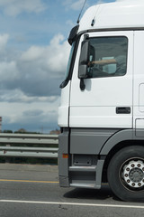 White Truck drives on a country road. Selective focus