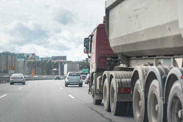 A lorry with tipping trailer in motion on the motorway.