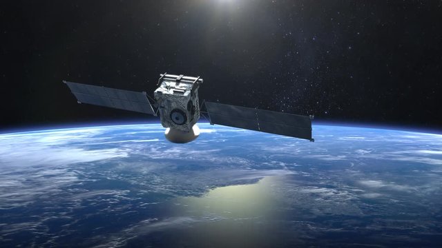 The satellite scan and monitor the Earth. The camera shoots the satellite close-up. The earth rotates slowly. 4K.
