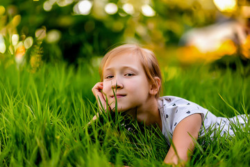 girl with a smile summer on the grass