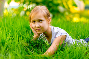 Naklejka na ściany i meble girl with a smile summer on the grass