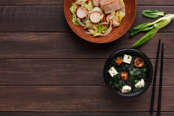 Bowl of rice noodles on wooden background