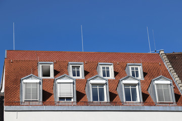Fototapeta na wymiar Roof windows on building in Augsburg, Germany