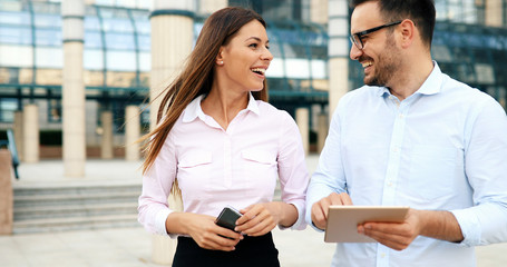 Fototapeta premium Picture of young attractive business partners standing