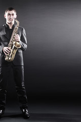 Naklejka premium Saxophone player Jazz musician saxophonist