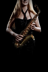 Saxophone player. Saxophonist woman Sax player