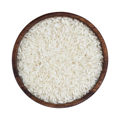 Basmati rice groats in wooden bowl isolated on white background. Top view