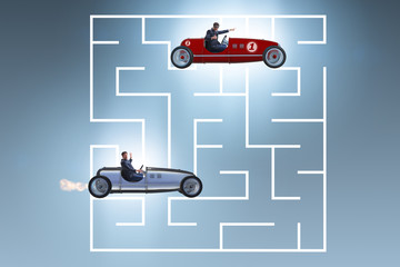 Fototapeta premium Uncertainty concept with businessman lost in maze labyrinth