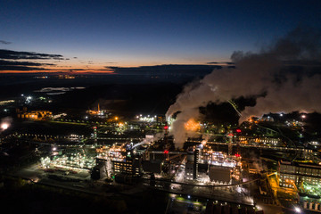 Fototapeta na wymiar Aerial view of oil refinery. Industrial view at oil refinery plants with lots of light at night. Panorama.