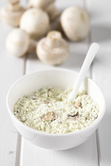Instant mushroom soup powder in bowl, photographed with natural light (Selective Focus, Focus one third into the soup powder)