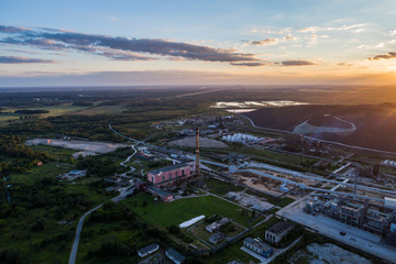Aerial view Oil refinery with a background of mountains and sky at sunset. Aerial photography. Kohtla-Järve city, Estonia, Ida-Virumaa.
