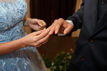 Obraz na płótnie Canvas Wedding ceremony with wedding rings for bride and groom