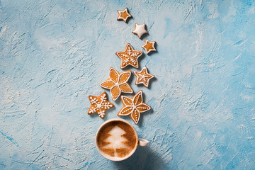 Christmas concept. Cup of coffee with stars gingerbreads.