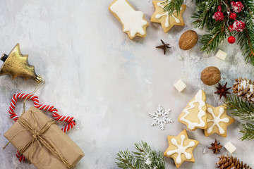 Christmas background frame or greeting xmas card. Gingerbread on a festive Christmas table. Flat lay, top view with copy space.