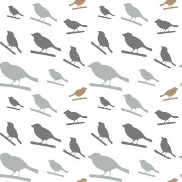 Birds pattern. Vector seamless pattern with hand drawn silhouettes of birds on a tree branch.