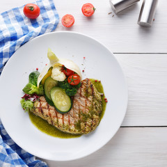Grilled beefsteak with vegetables and green bell pepper sauce
