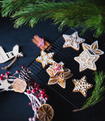 Christmas concept. tars gingerbreads on a table with branch of fir