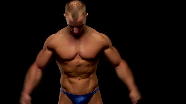 young bodybuilder training in studio