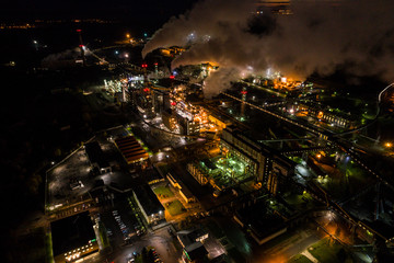 Aerial view of oil refinery. Industrial view at oil refinery plants with lots of light at night. 