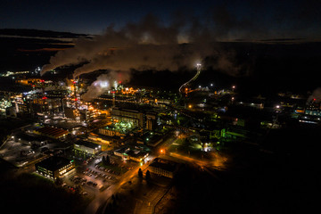 Aerial view of oil refinery. Industrial view at oil refinery plants with lots of light at night. 