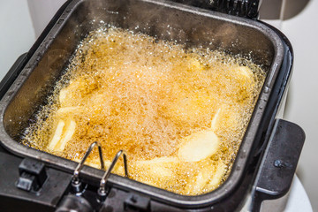 fried potatoes frying in boiling oil