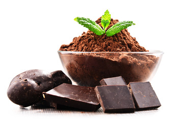 Composition with bowl of cocoa powder isolated on white