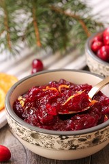 Homemade Cranberry Sauce served in a bowl on festive background