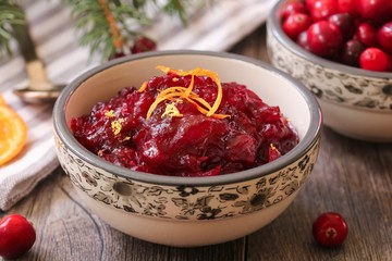 Homemade Cranberry Sauce served in a bowl on festive background