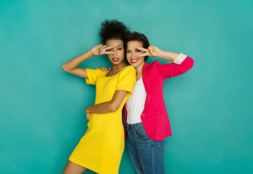 Two Girlfriends Fooling And Dancing At Azur Studio Background