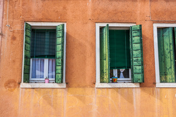 Fototapeta na wymiar Beautiful colorful house facade on Venice, Italy. 