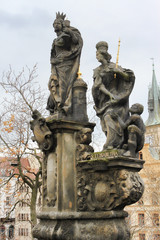 Fototapeta na wymiar Sculptural composition on the Charles Bridge: St. Margaret, Varvara and Elizabeth