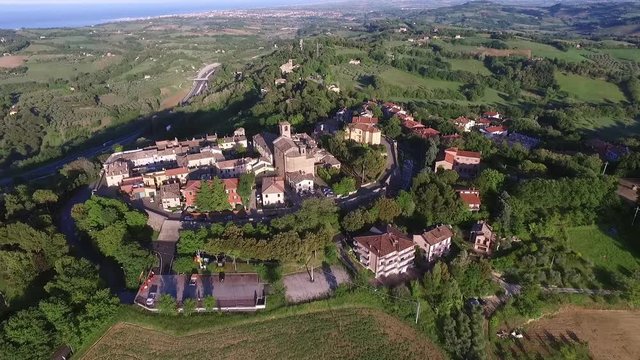 Italia, Pesaro Giugno 2017 - vista aerea del bordo mediavale di Novilara in provincia di Pesaro. Il borgo &egrave; immerso nel verde dei campi e a  pochi passi dal mare
