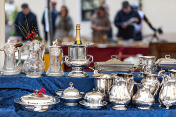 Champagne cooler and other silverware on flea market