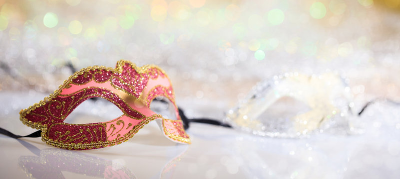 Pink Carnival Mask On Bokeh Background