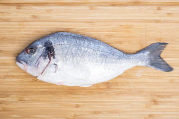 Raw Sea Bream on a Bamboo Cutting Board