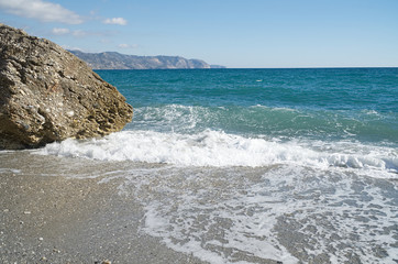 A nice beach with big rocks in Nerja, Malaga province, Andalusia,Spain.                  