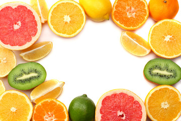 healthy food. mix sliced lemon, green lime, orange, mandarin, kiwi fruit and grapefruit with green leaf isolated on white background. top view with copy space