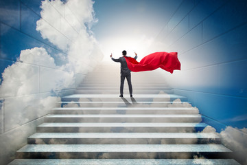 Businessman superhero successful in career ladder concept