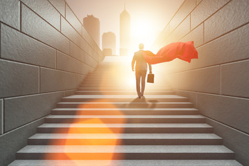 Businessman superhero successful in career ladder concept © Elnur