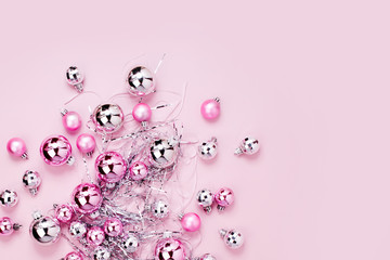 Pink Christmas balls background. Flat lay, top view