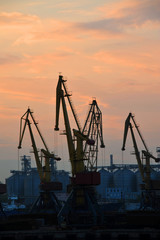 Obraz premium Port cargo crane at sunset