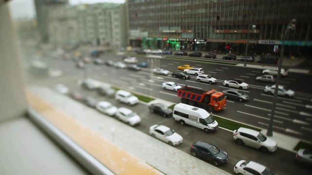 Lots of cars parking in the city. Footage. Roads are crowded with cars. Rapid modern urban life