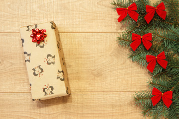 New Year / Christmas gifts in package, tree with red bows on the wooden background template