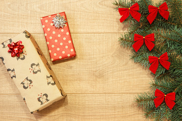 New Year / Christmas gifts in package, tree with red bows on the wooden background template