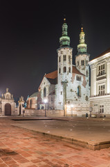 Fototapeta na wymiar St Andrew church on Grodzka street in Krakow, illuminated in the night