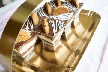 miniature pastries reflected in the cardboard tray
