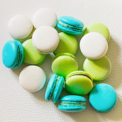 French colorful macarons isolated on white  background.