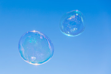 big soap bubble over a blue sky background